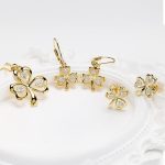 14kt Gold Vermeil Shamrock Stud Earrings with White Sapphires Set on Prop - Gallery Thumbnail Image